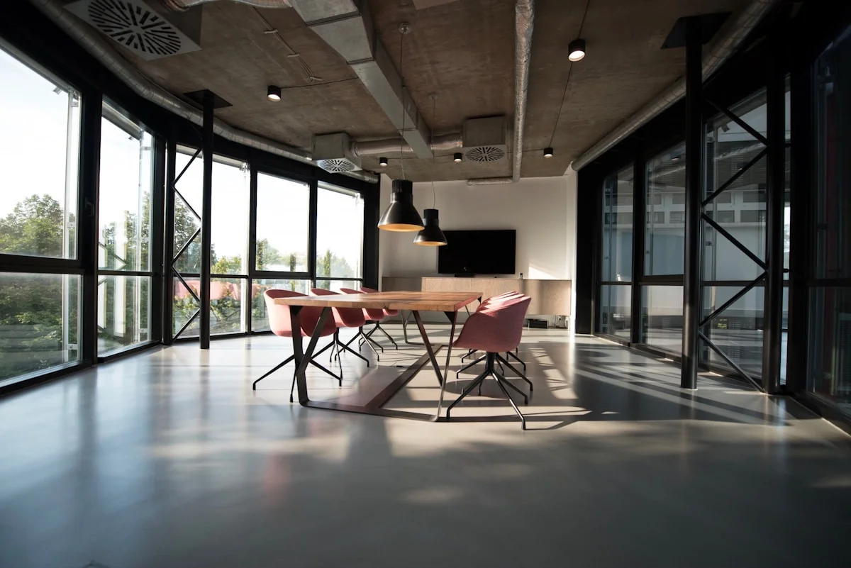 Commercial meeting space with finished flooring and bespoke timber furniture